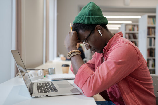 stressed student applying on laptop